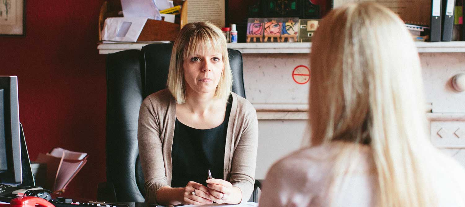 A solicitor meeting a client in the Lurgan office